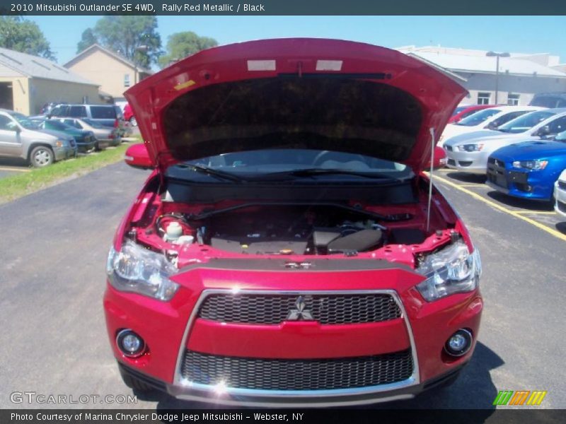 Rally Red Metallic / Black 2010 Mitsubishi Outlander SE 4WD