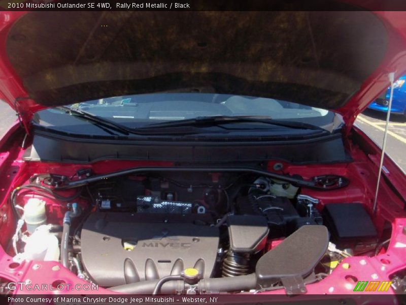 Rally Red Metallic / Black 2010 Mitsubishi Outlander SE 4WD
