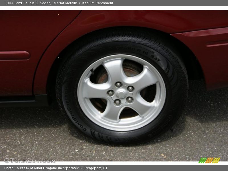 Merlot Metallic / Medium Parchment 2004 Ford Taurus SE Sedan