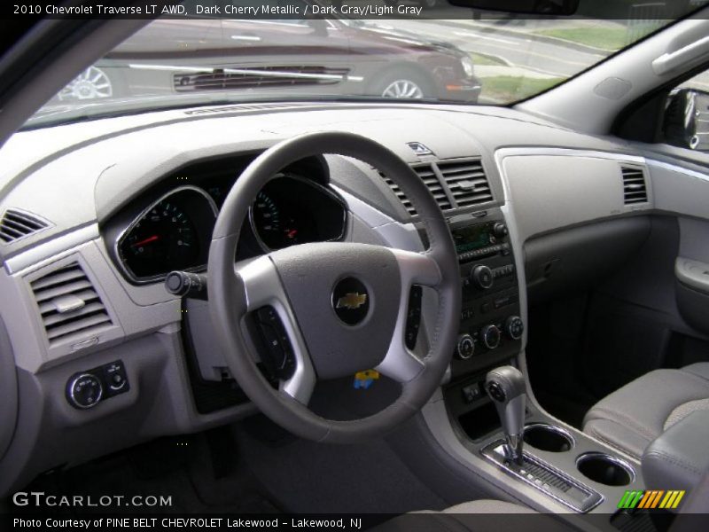 Dark Cherry Metallic / Dark Gray/Light Gray 2010 Chevrolet Traverse LT AWD