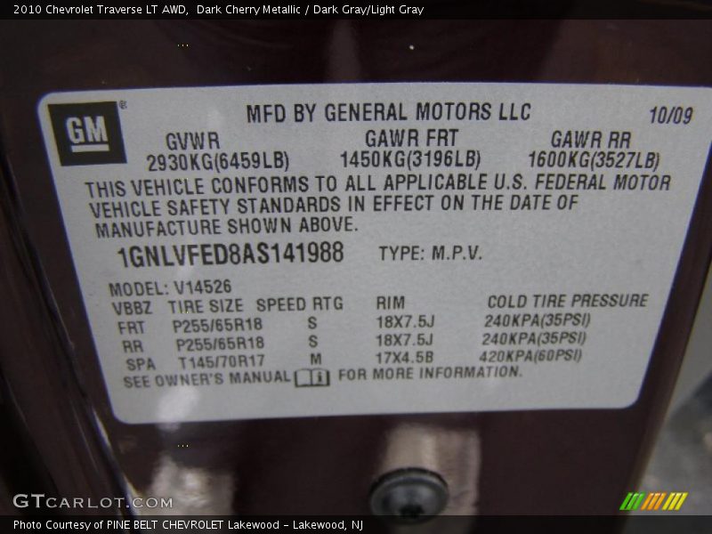 Dark Cherry Metallic / Dark Gray/Light Gray 2010 Chevrolet Traverse LT AWD