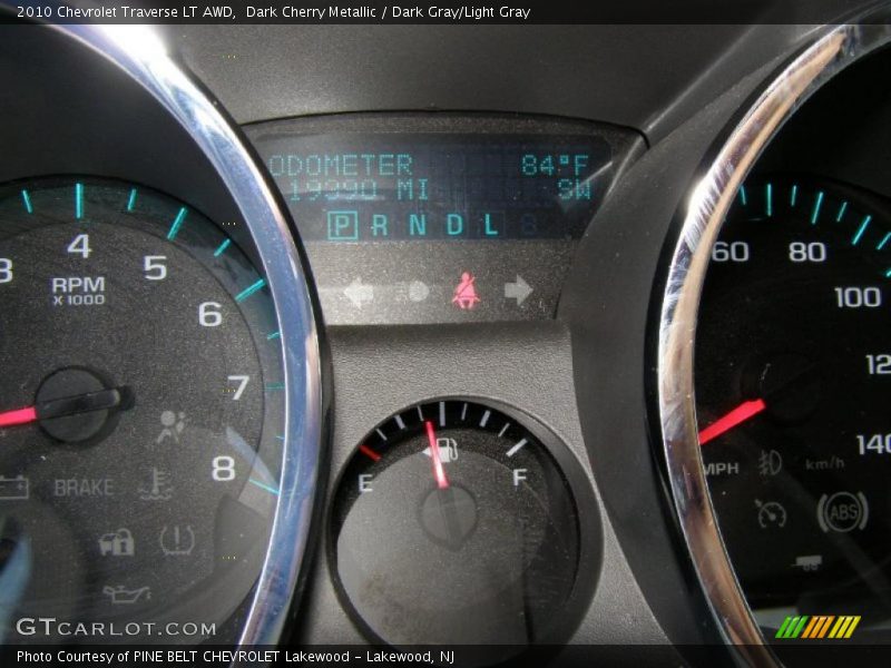 Dark Cherry Metallic / Dark Gray/Light Gray 2010 Chevrolet Traverse LT AWD