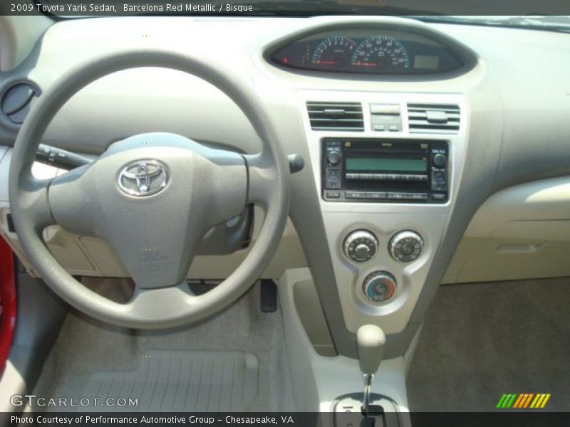 Barcelona Red Metallic / Bisque 2009 Toyota Yaris Sedan