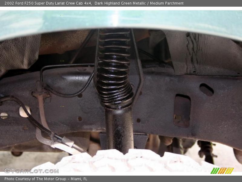 Dark Highland Green Metallic / Medium Parchment 2002 Ford F250 Super Duty Lariat Crew Cab 4x4