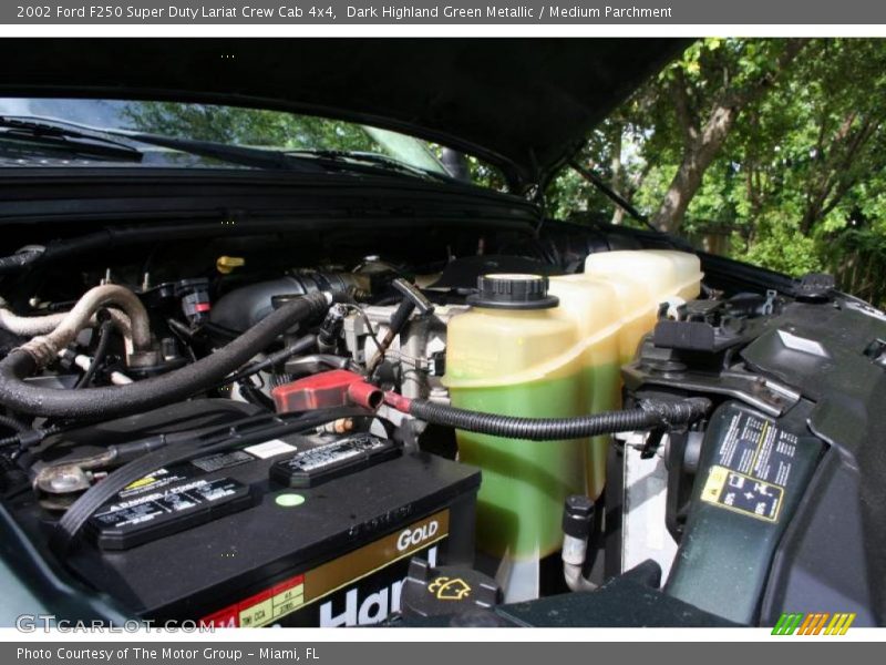 Dark Highland Green Metallic / Medium Parchment 2002 Ford F250 Super Duty Lariat Crew Cab 4x4