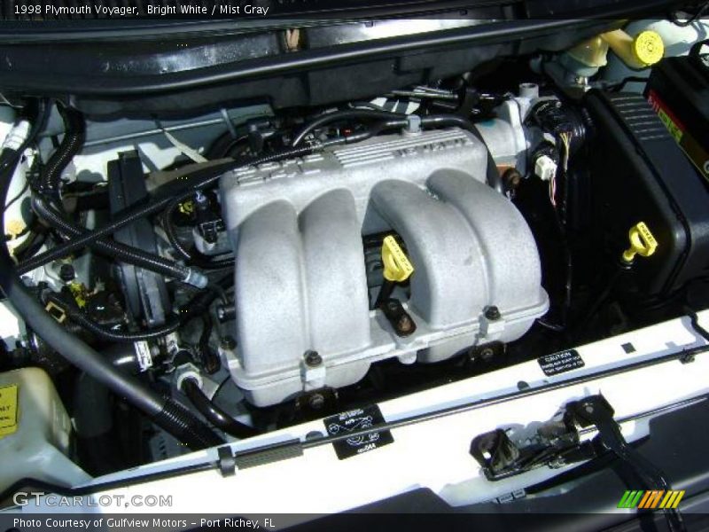 Bright White / Mist Gray 1998 Plymouth Voyager