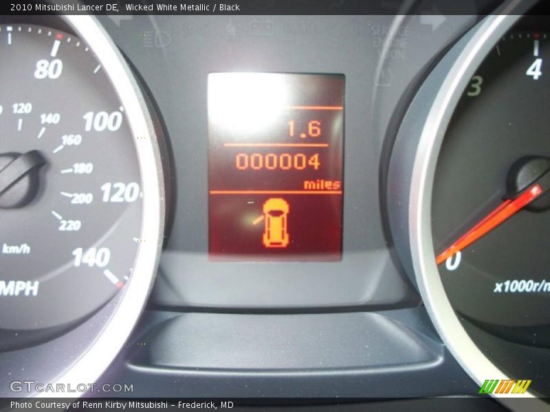 Wicked White Metallic / Black 2010 Mitsubishi Lancer DE