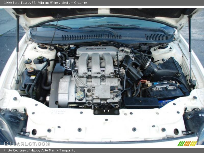 Vibrant White / Medium Graphite 1999 Ford Taurus SE