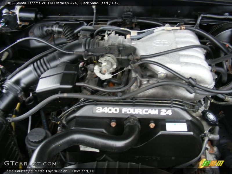 Black Sand Pearl / Oak 2002 Toyota Tacoma V6 TRD Xtracab 4x4