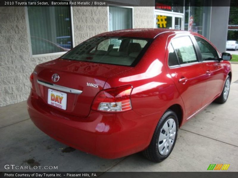 Barcelona Red Metallic / Bisque 2010 Toyota Yaris Sedan