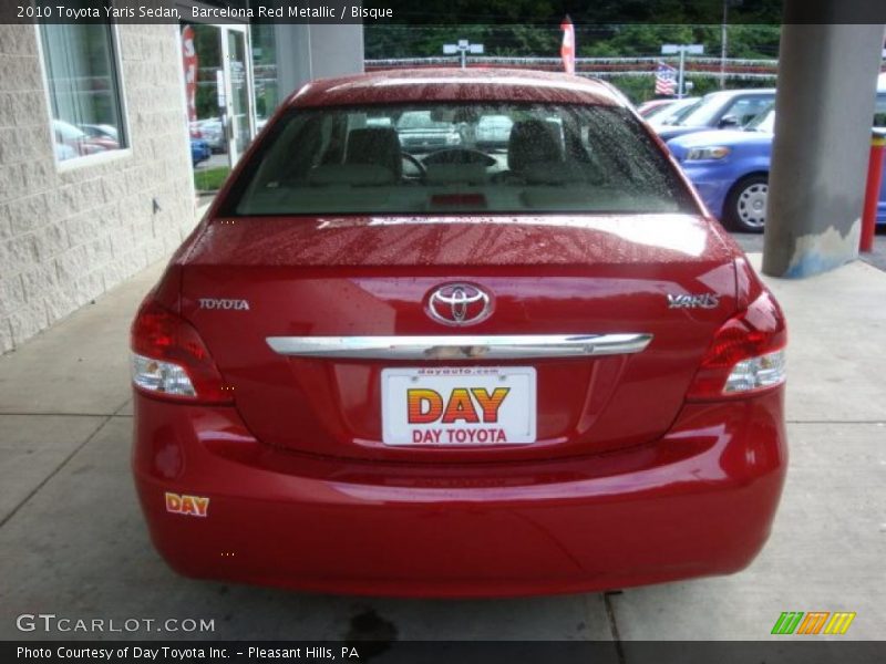 Barcelona Red Metallic / Bisque 2010 Toyota Yaris Sedan