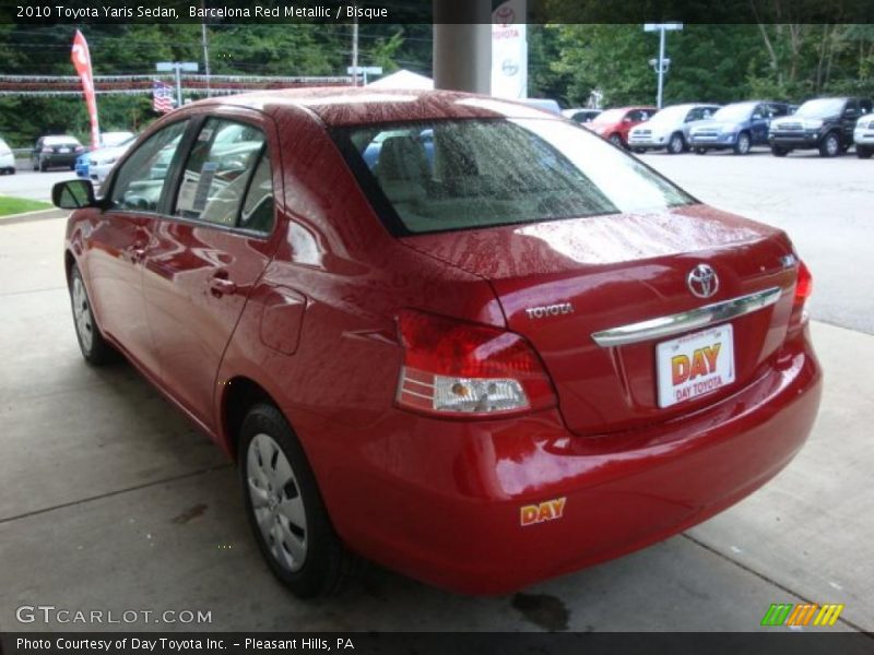 Barcelona Red Metallic / Bisque 2010 Toyota Yaris Sedan