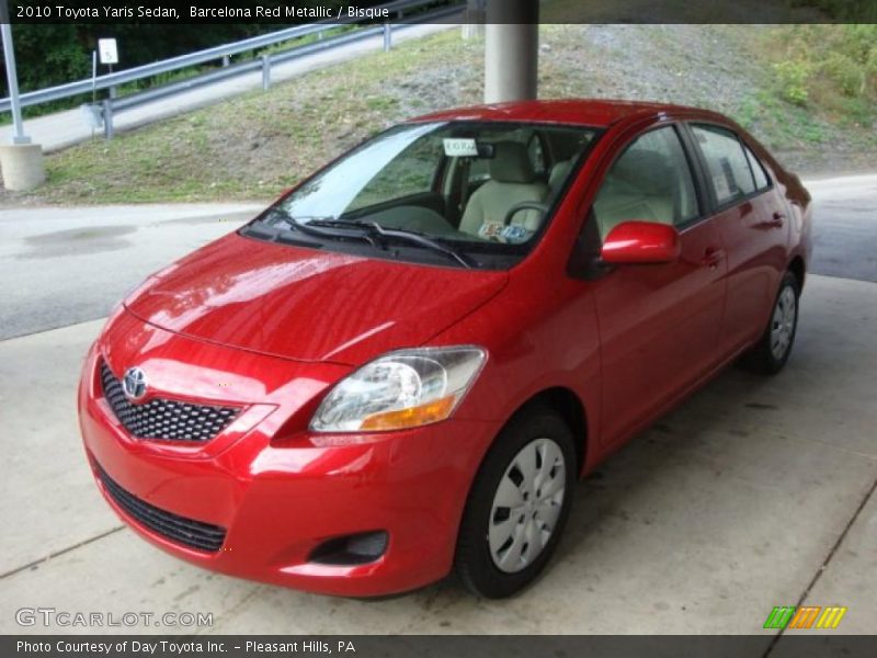 Barcelona Red Metallic / Bisque 2010 Toyota Yaris Sedan