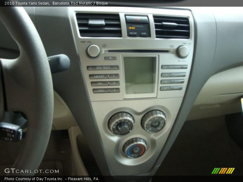 Barcelona Red Metallic / Bisque 2010 Toyota Yaris Sedan