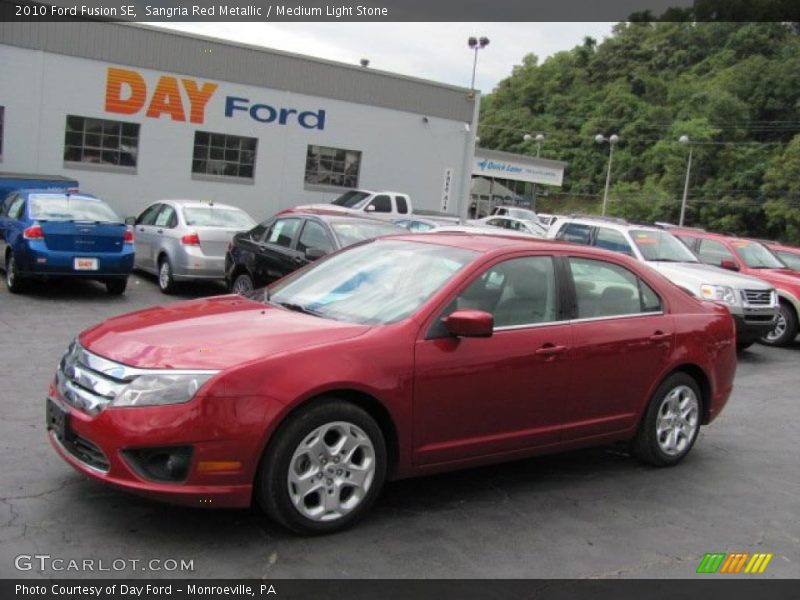 Sangria Red Metallic / Medium Light Stone 2010 Ford Fusion SE