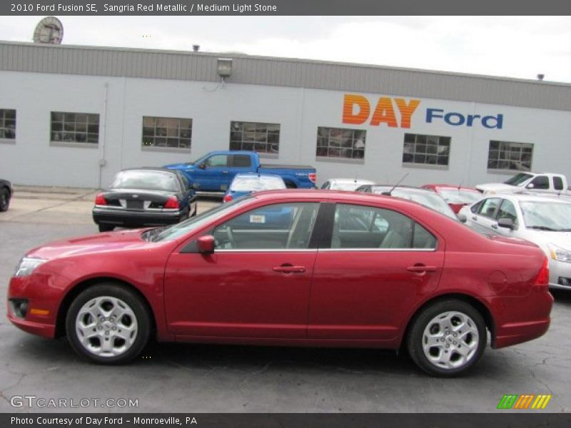 Sangria Red Metallic / Medium Light Stone 2010 Ford Fusion SE