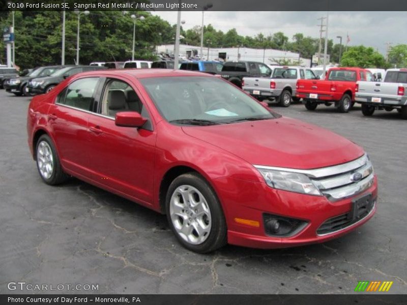 Sangria Red Metallic / Medium Light Stone 2010 Ford Fusion SE