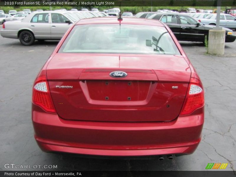 Sangria Red Metallic / Medium Light Stone 2010 Ford Fusion SE