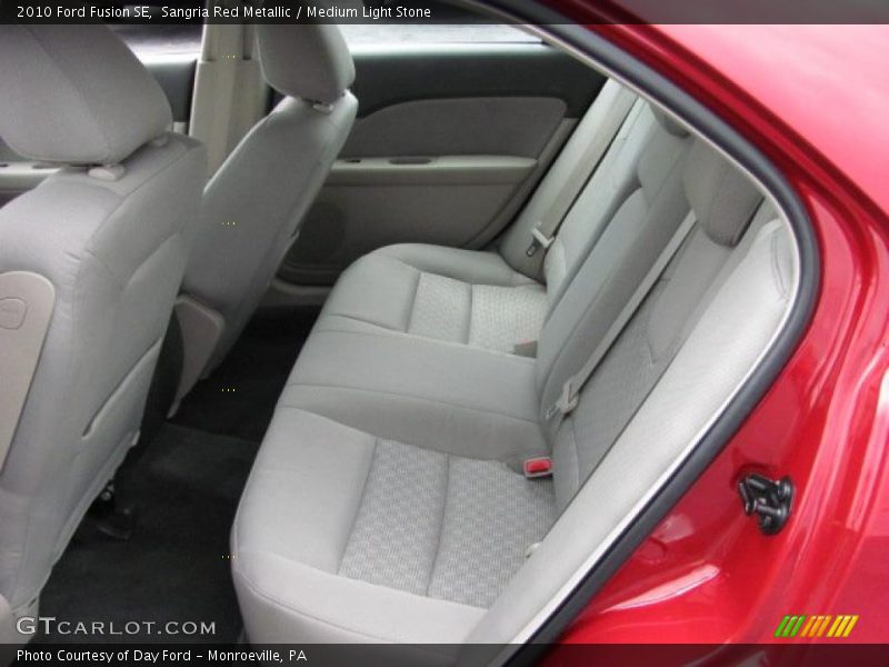 Sangria Red Metallic / Medium Light Stone 2010 Ford Fusion SE