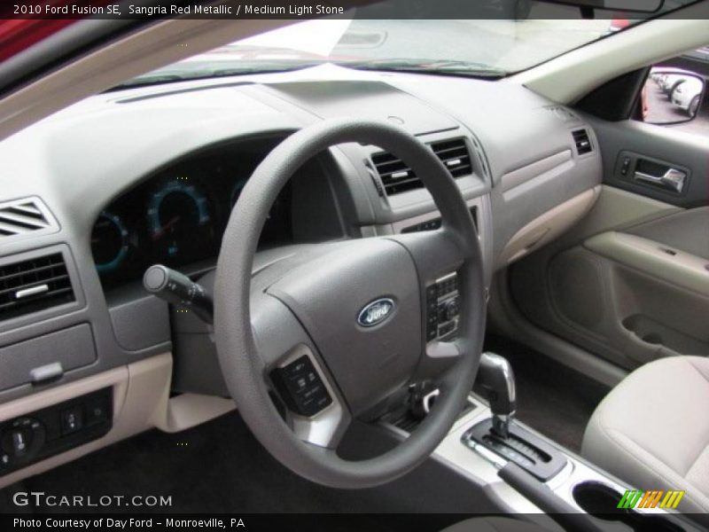 Sangria Red Metallic / Medium Light Stone 2010 Ford Fusion SE