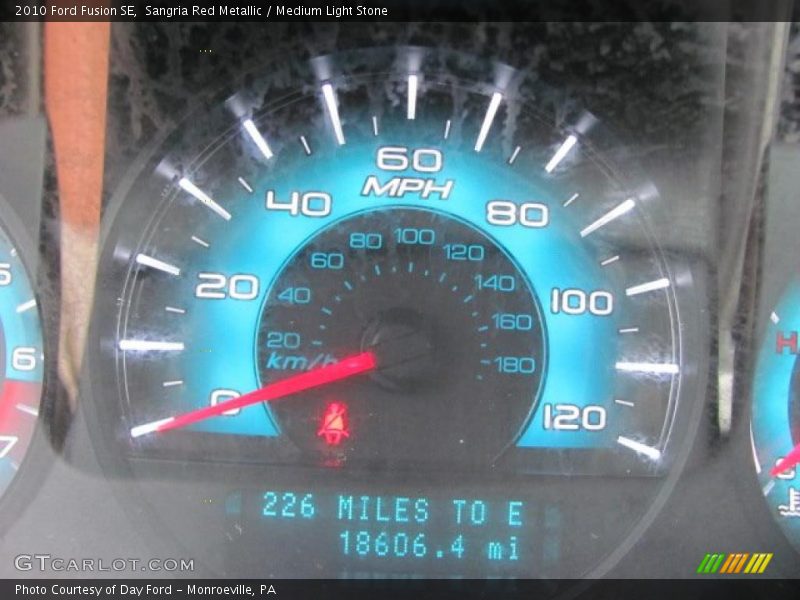 Sangria Red Metallic / Medium Light Stone 2010 Ford Fusion SE