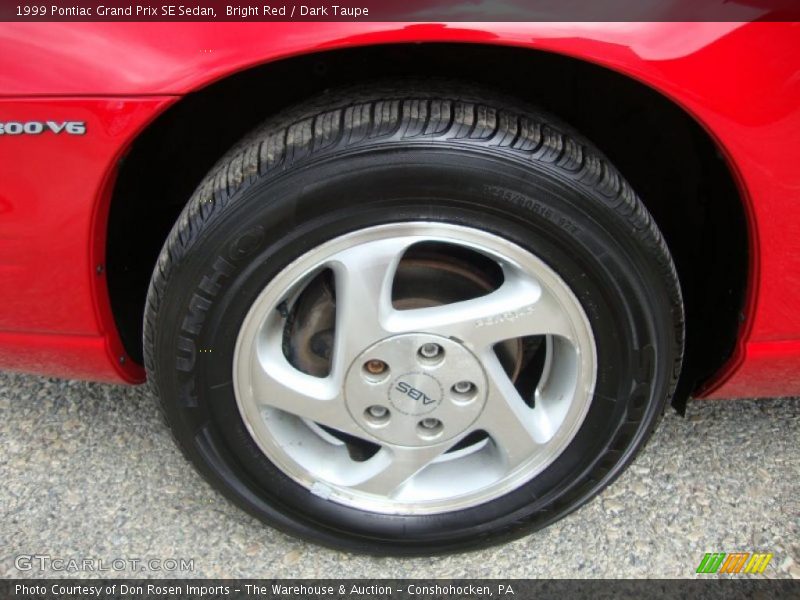 Bright Red / Dark Taupe 1999 Pontiac Grand Prix SE Sedan