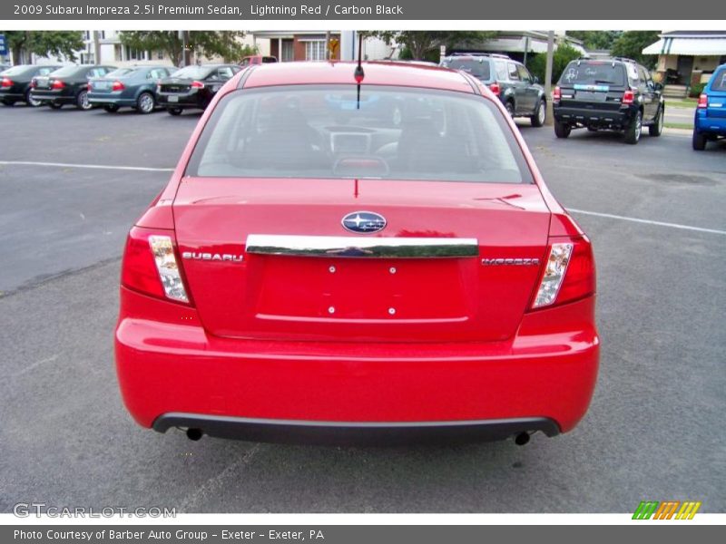 Lightning Red / Carbon Black 2009 Subaru Impreza 2.5i Premium Sedan