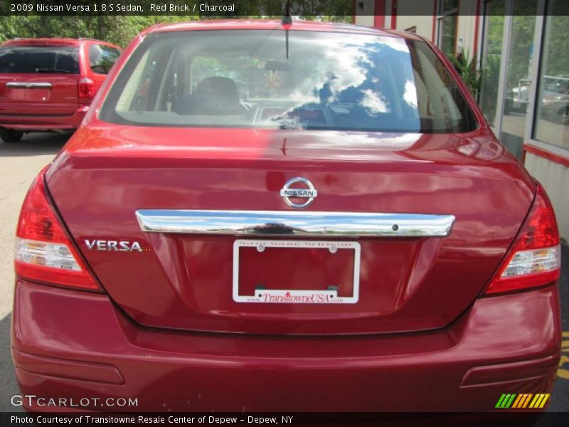 Red Brick / Charcoal 2009 Nissan Versa 1.8 S Sedan