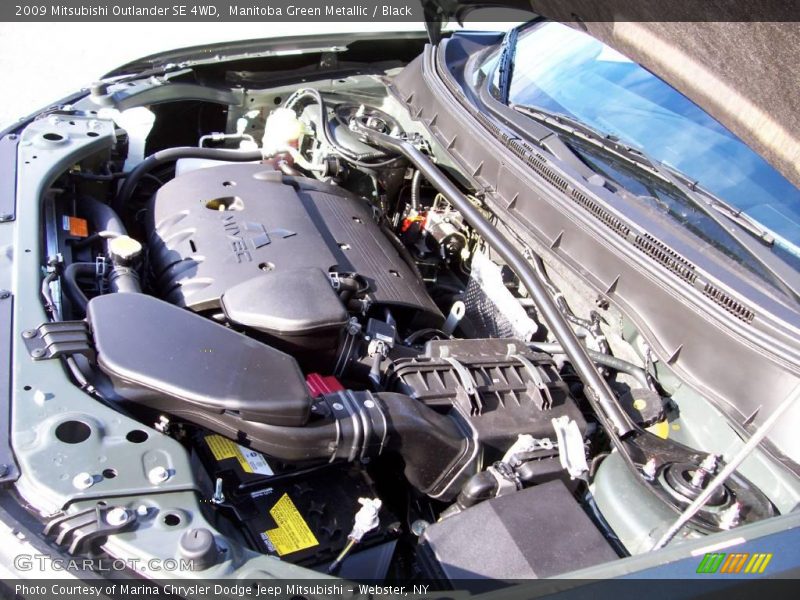 Manitoba Green Metallic / Black 2009 Mitsubishi Outlander SE 4WD