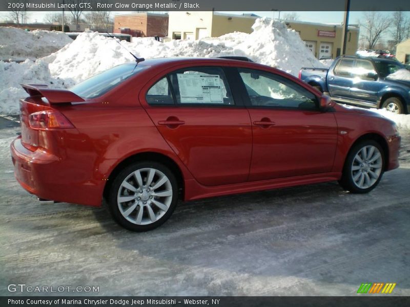 Rotor Glow Orange Metallic / Black 2009 Mitsubishi Lancer GTS