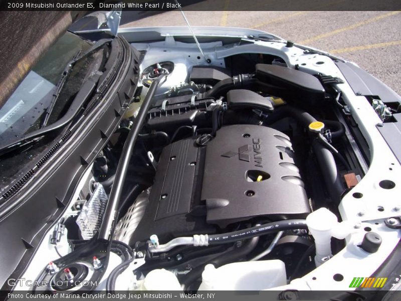 Diamond White Pearl / Black 2009 Mitsubishi Outlander ES