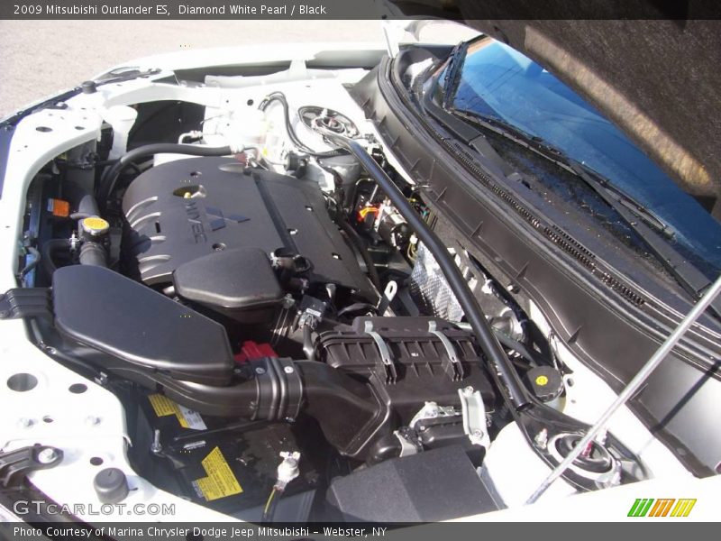 Diamond White Pearl / Black 2009 Mitsubishi Outlander ES