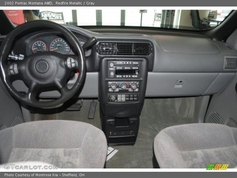 Redfire Metallic / Gray 2002 Pontiac Montana AWD