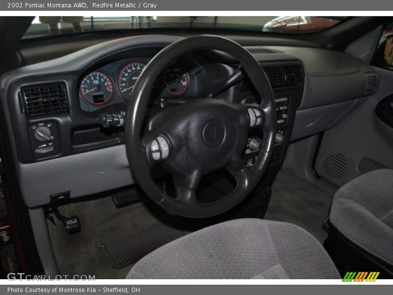 Redfire Metallic / Gray 2002 Pontiac Montana AWD