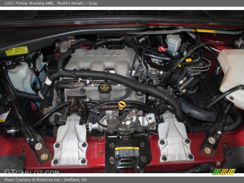 Redfire Metallic / Gray 2002 Pontiac Montana AWD