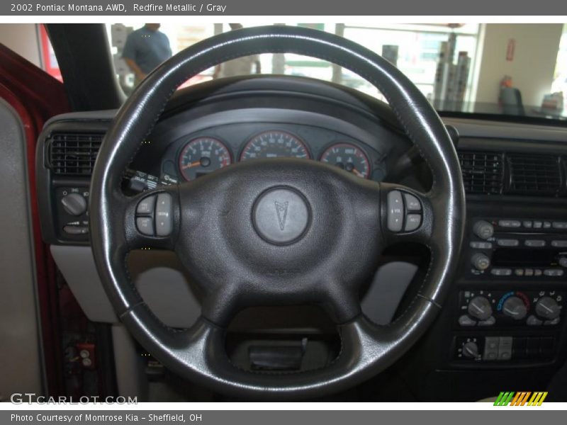 Redfire Metallic / Gray 2002 Pontiac Montana AWD