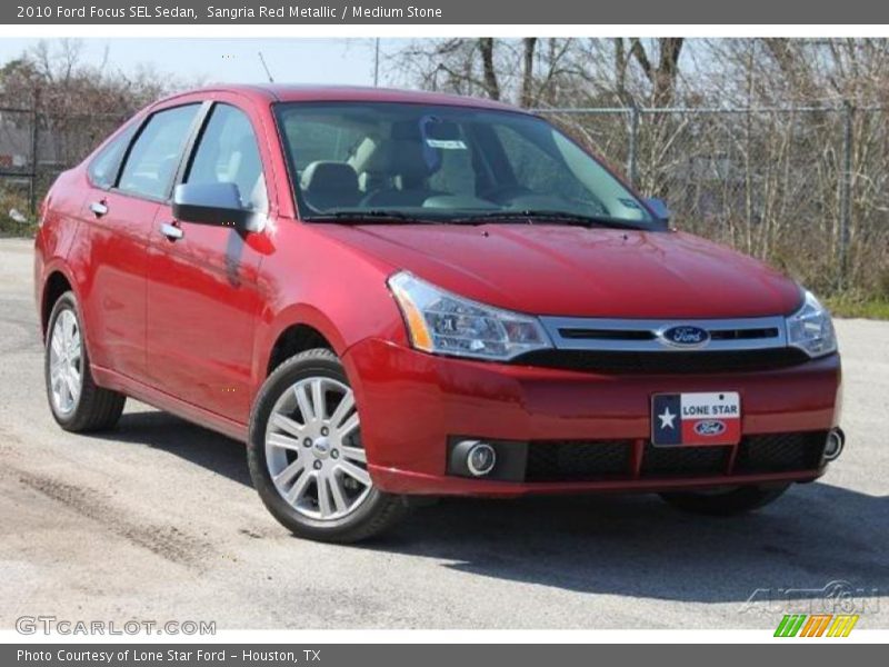 Sangria Red Metallic / Medium Stone 2010 Ford Focus SEL Sedan