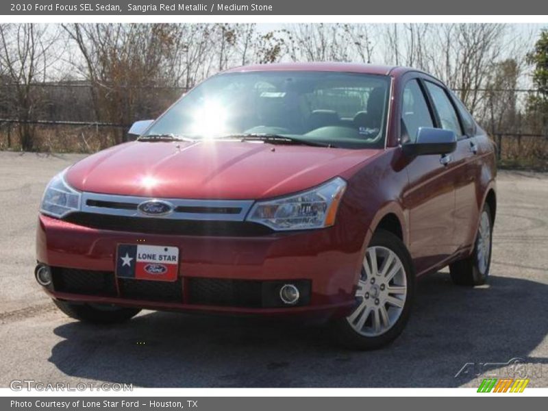 Sangria Red Metallic / Medium Stone 2010 Ford Focus SEL Sedan