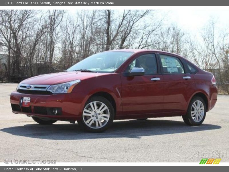 Sangria Red Metallic / Medium Stone 2010 Ford Focus SEL Sedan