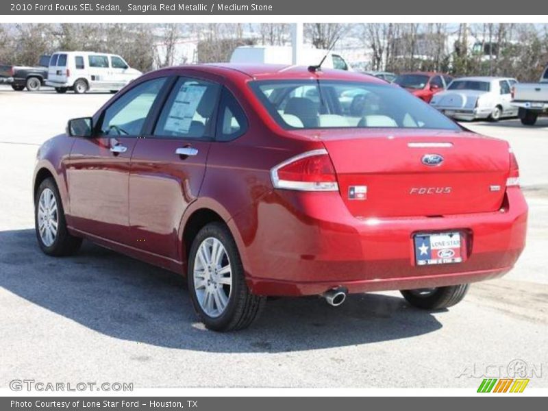 Sangria Red Metallic / Medium Stone 2010 Ford Focus SEL Sedan