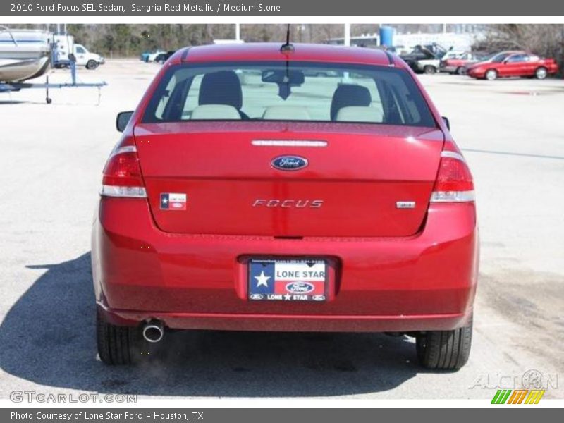 Sangria Red Metallic / Medium Stone 2010 Ford Focus SEL Sedan