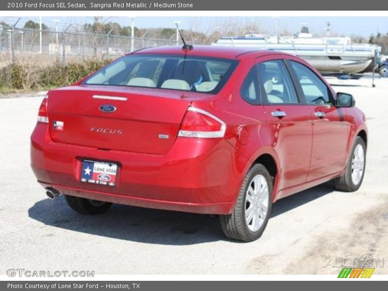 Sangria Red Metallic / Medium Stone 2010 Ford Focus SEL Sedan