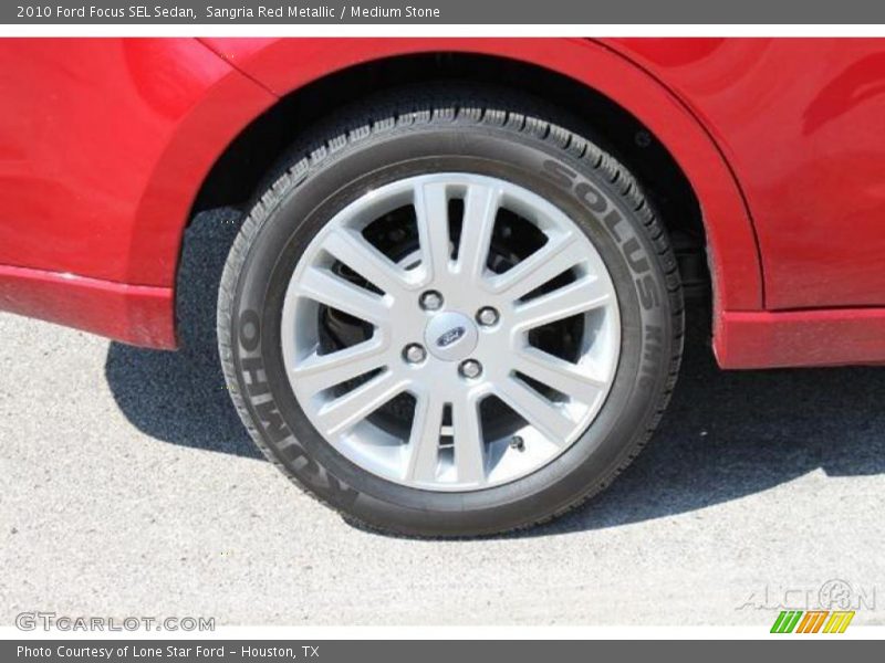 Sangria Red Metallic / Medium Stone 2010 Ford Focus SEL Sedan