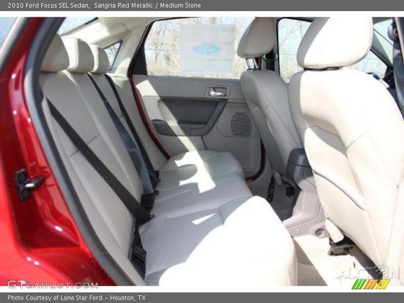 Sangria Red Metallic / Medium Stone 2010 Ford Focus SEL Sedan