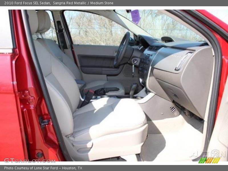 Sangria Red Metallic / Medium Stone 2010 Ford Focus SEL Sedan