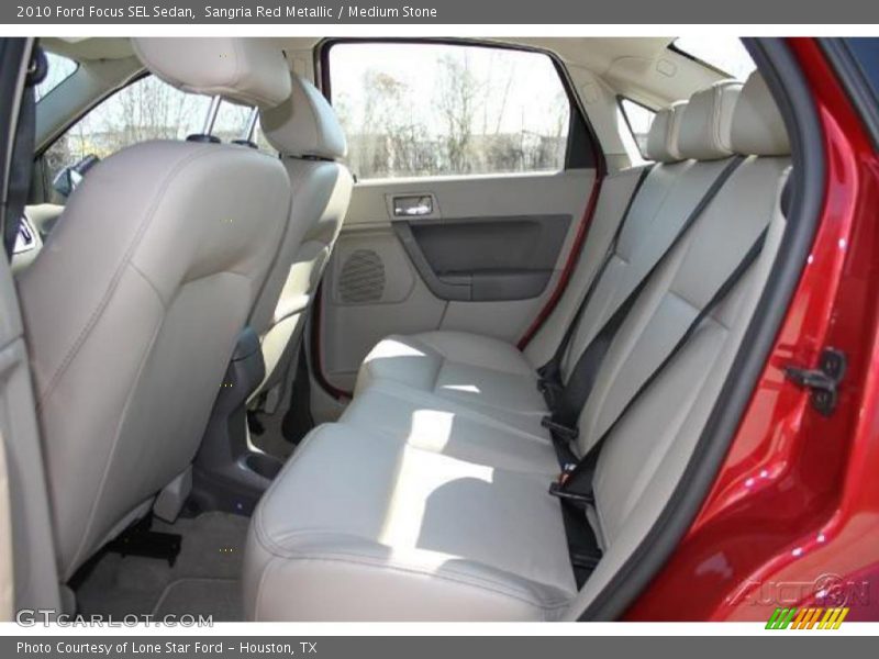 Sangria Red Metallic / Medium Stone 2010 Ford Focus SEL Sedan