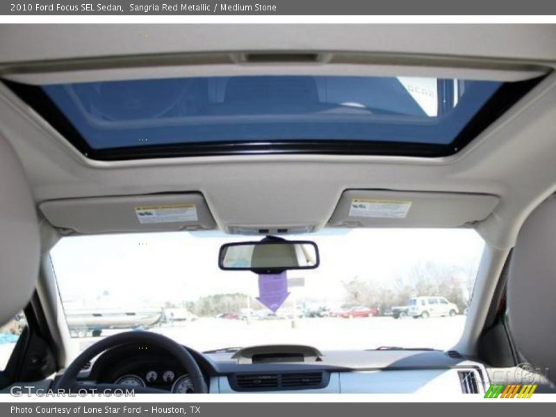 Sangria Red Metallic / Medium Stone 2010 Ford Focus SEL Sedan