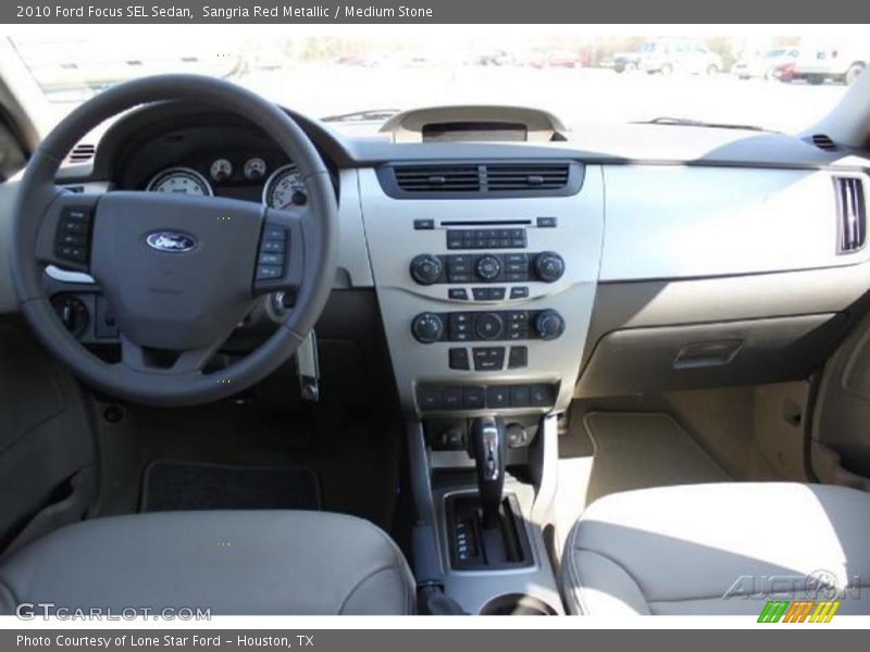 Sangria Red Metallic / Medium Stone 2010 Ford Focus SEL Sedan