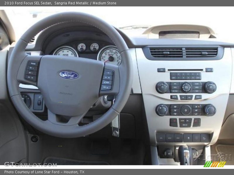 Sangria Red Metallic / Medium Stone 2010 Ford Focus SEL Sedan