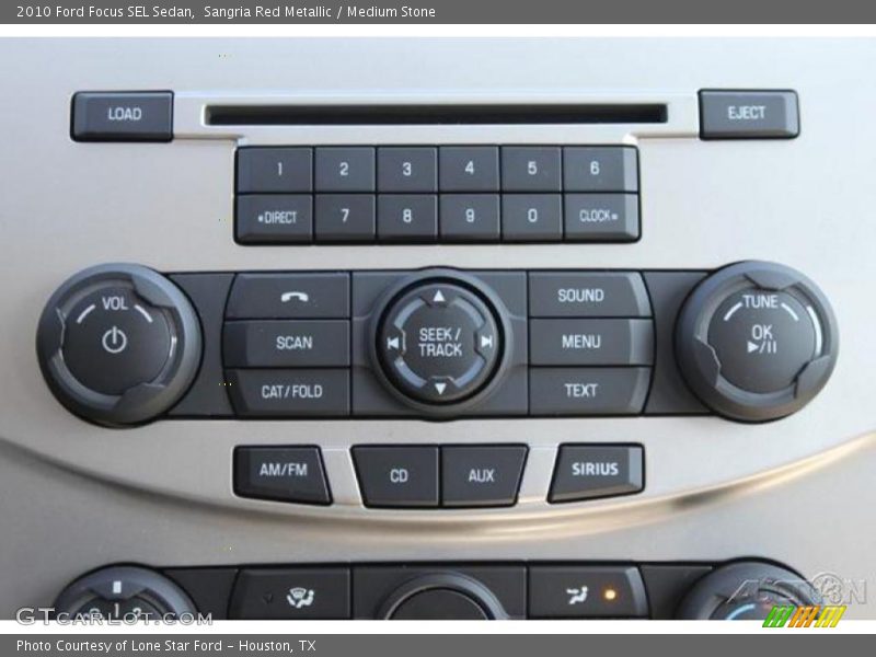 Sangria Red Metallic / Medium Stone 2010 Ford Focus SEL Sedan